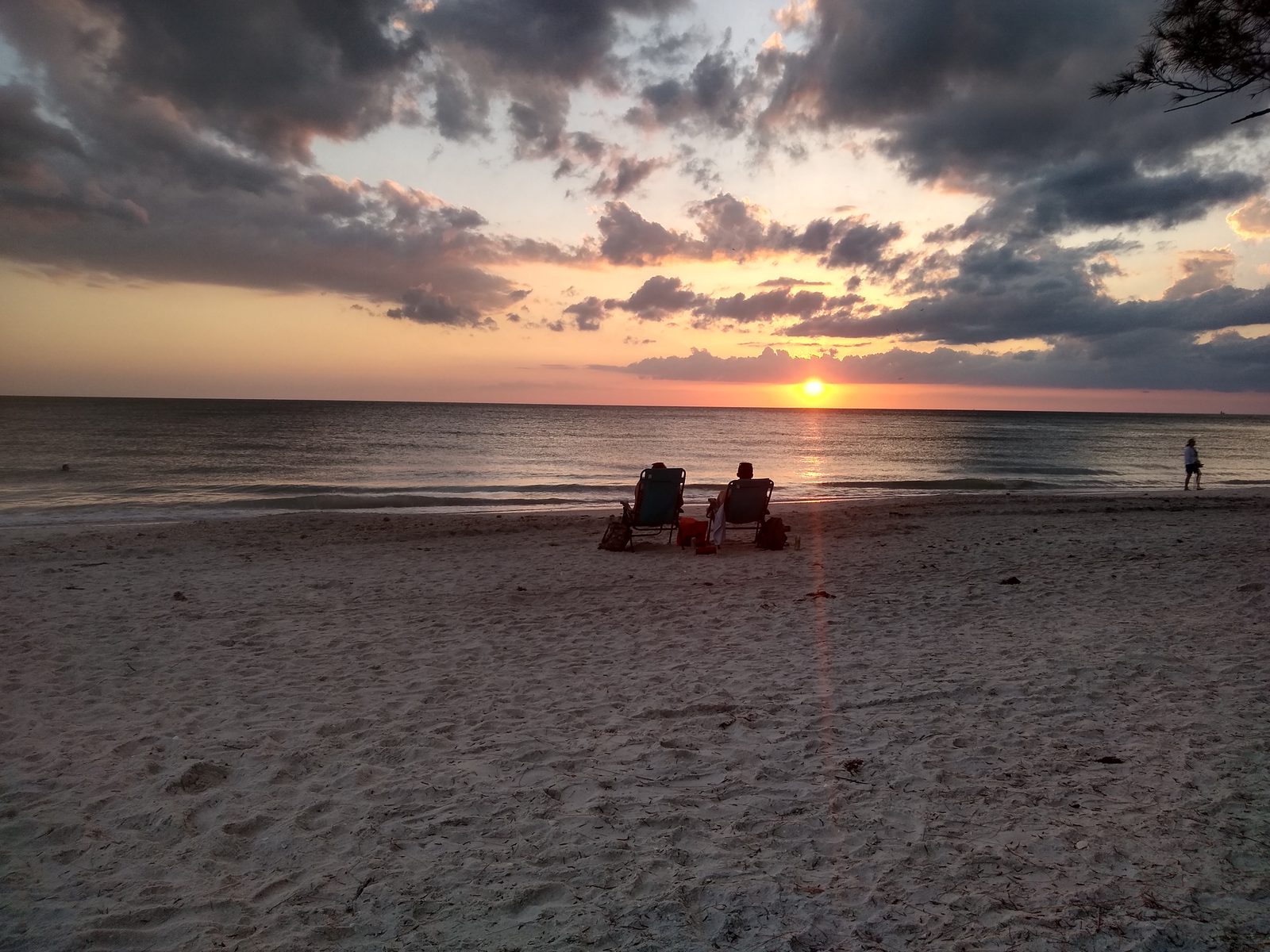 Storm clouds over the beach at sunset