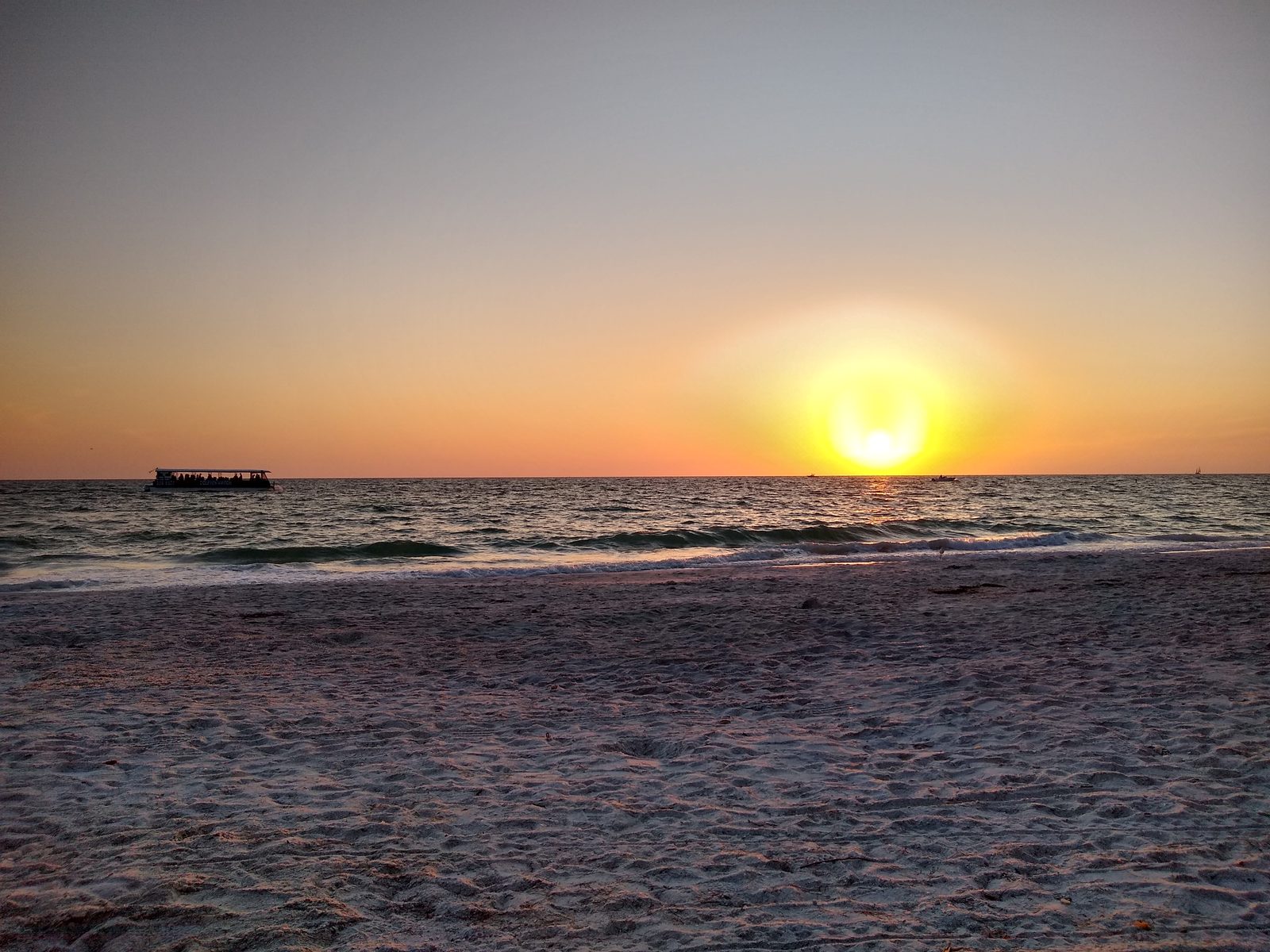 The sun going down over the water