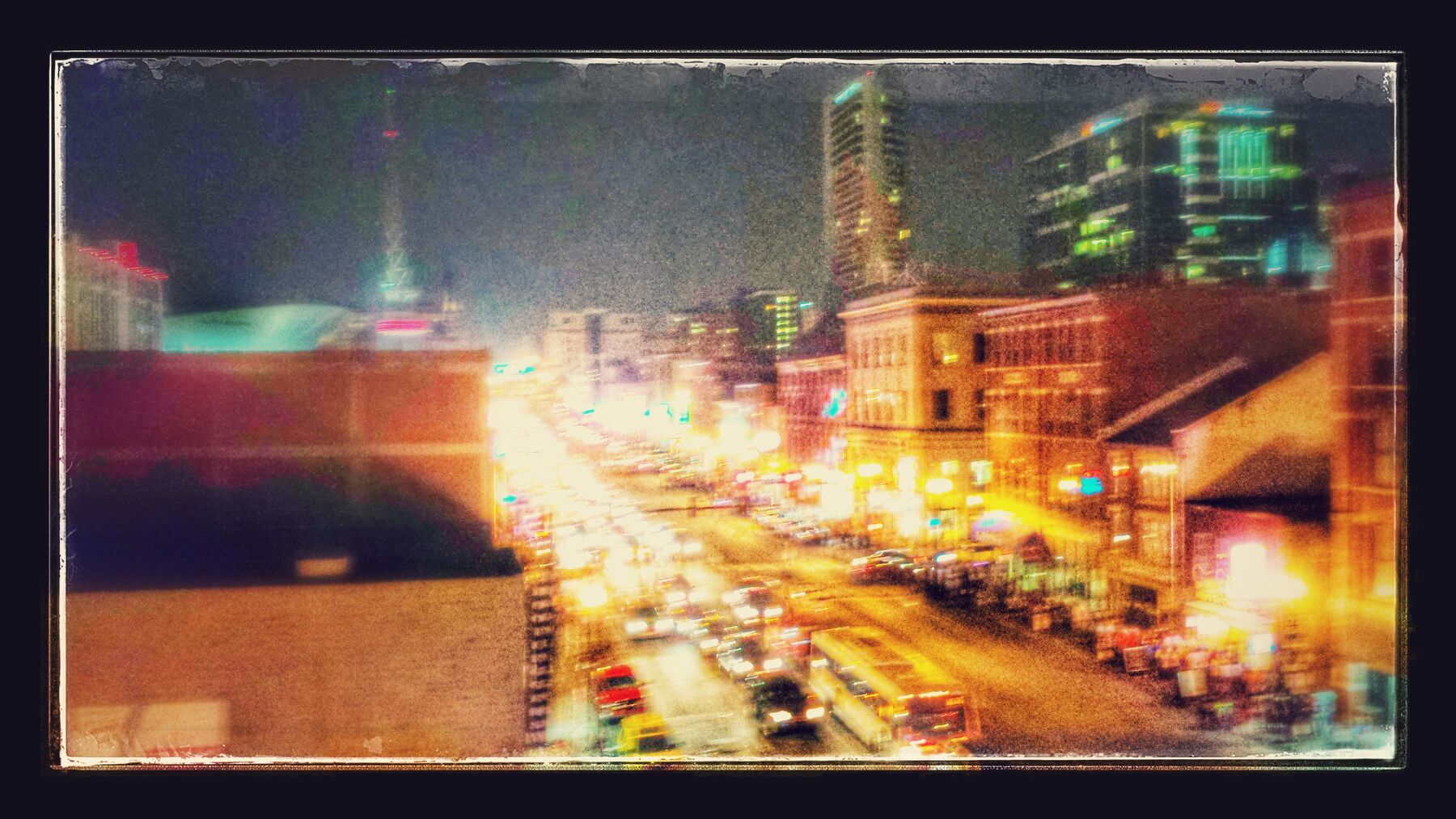 A city street lit up at night