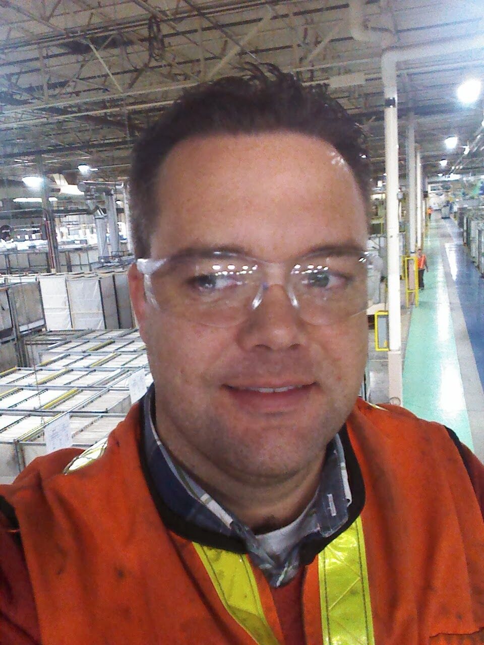 Justin on a plant floor in safety glasses