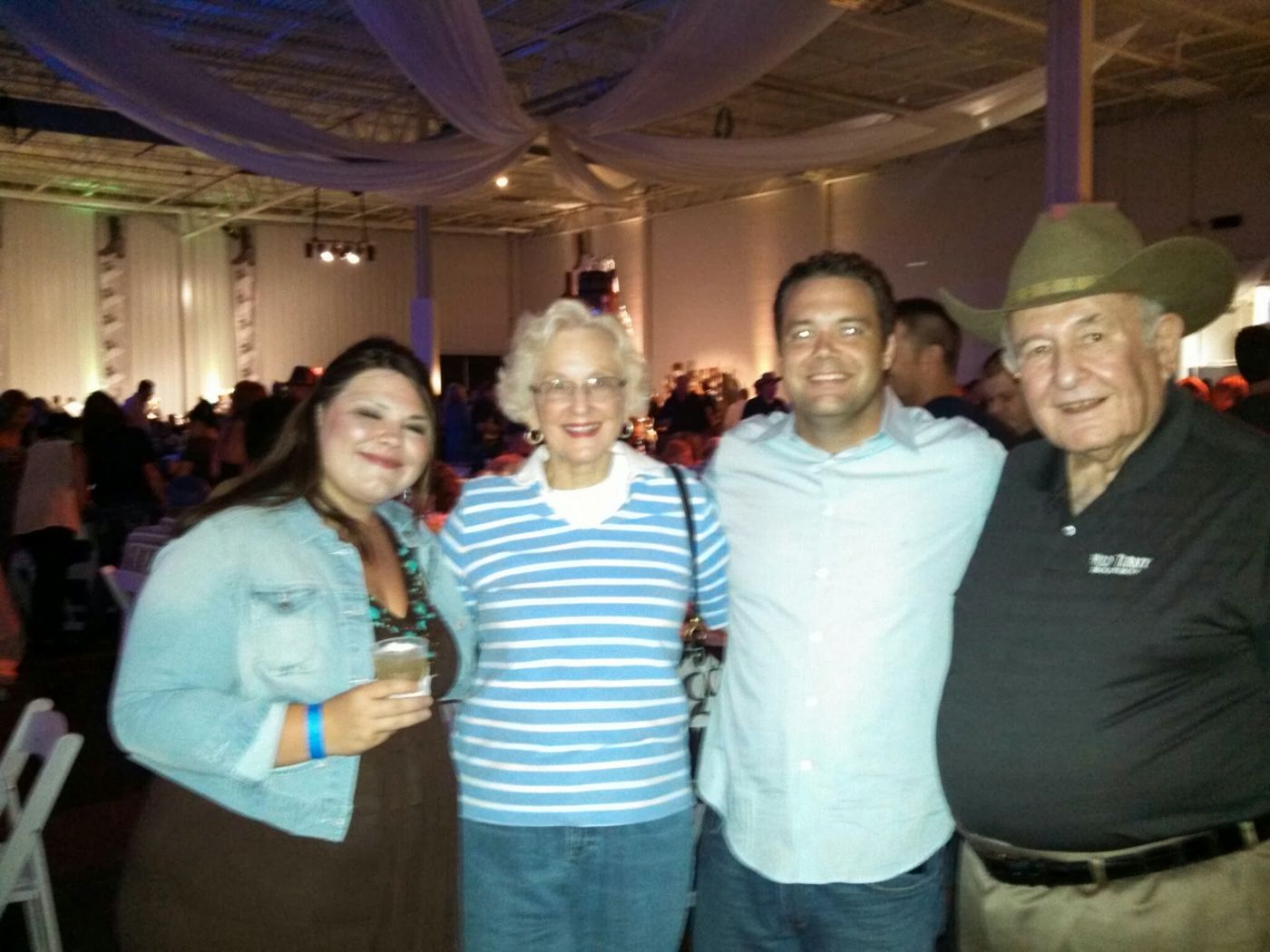 Justin with friends at a big event hall