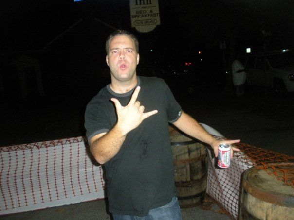 Justin at a party by a barrel