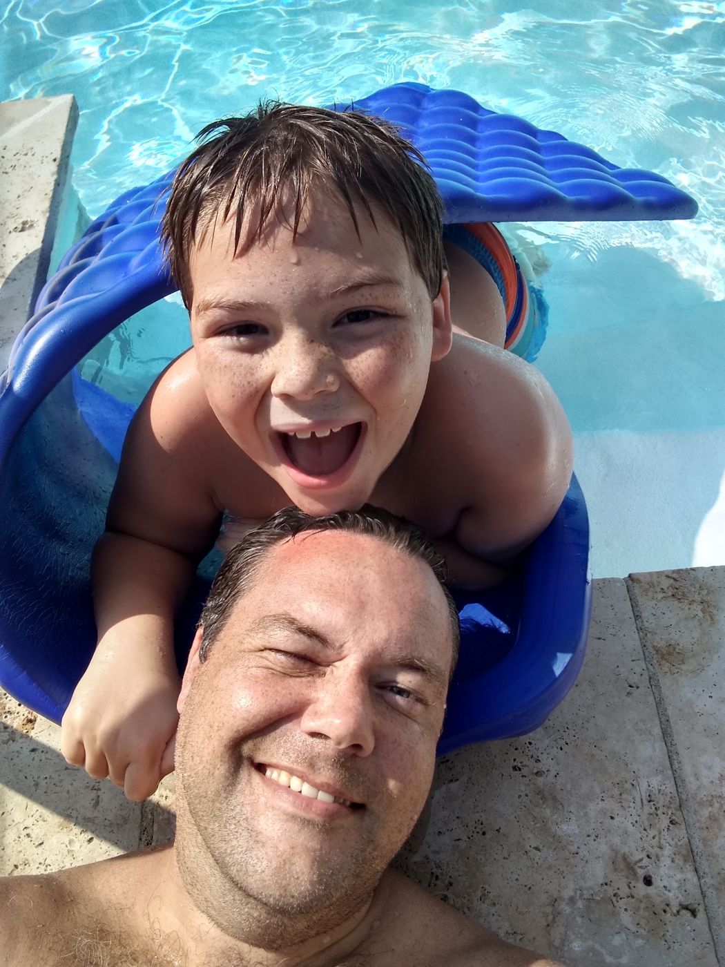 Justin and a kid in the pool