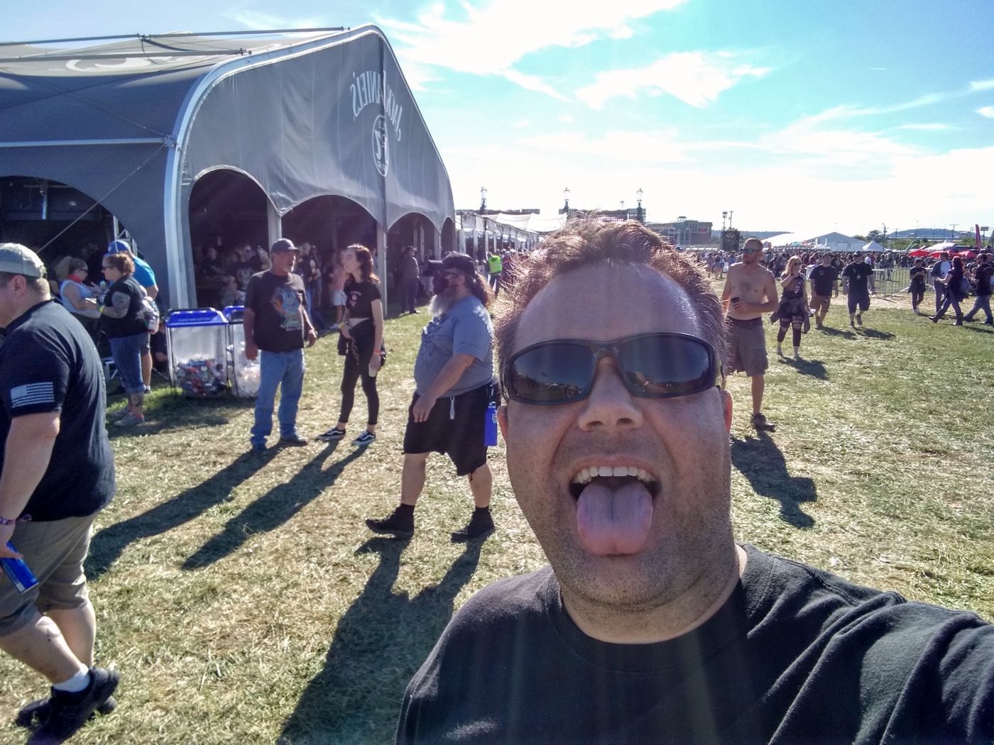 Justin at a festival, tongue out