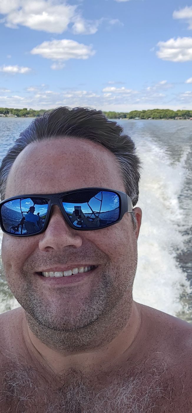 Justin on a boat