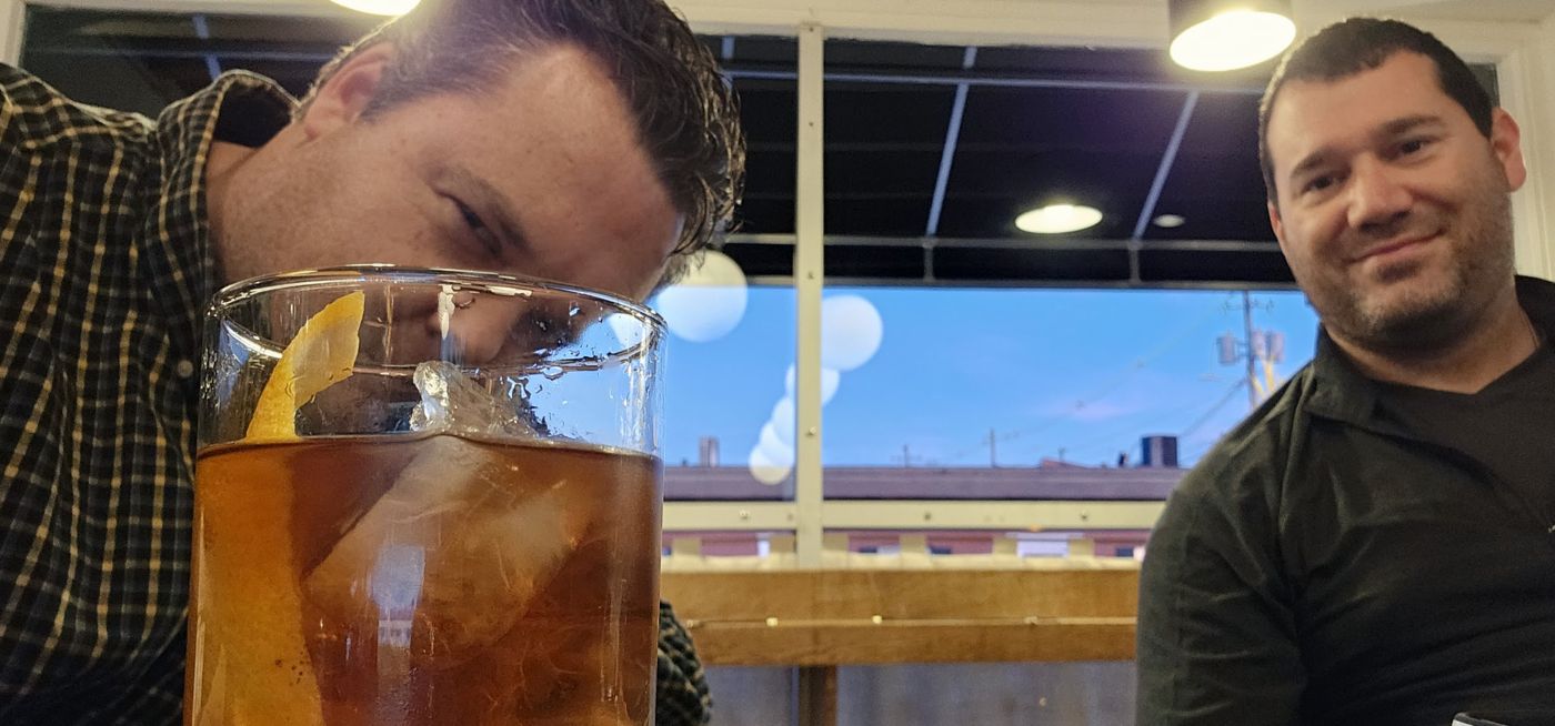 Justin and a friend with a drink