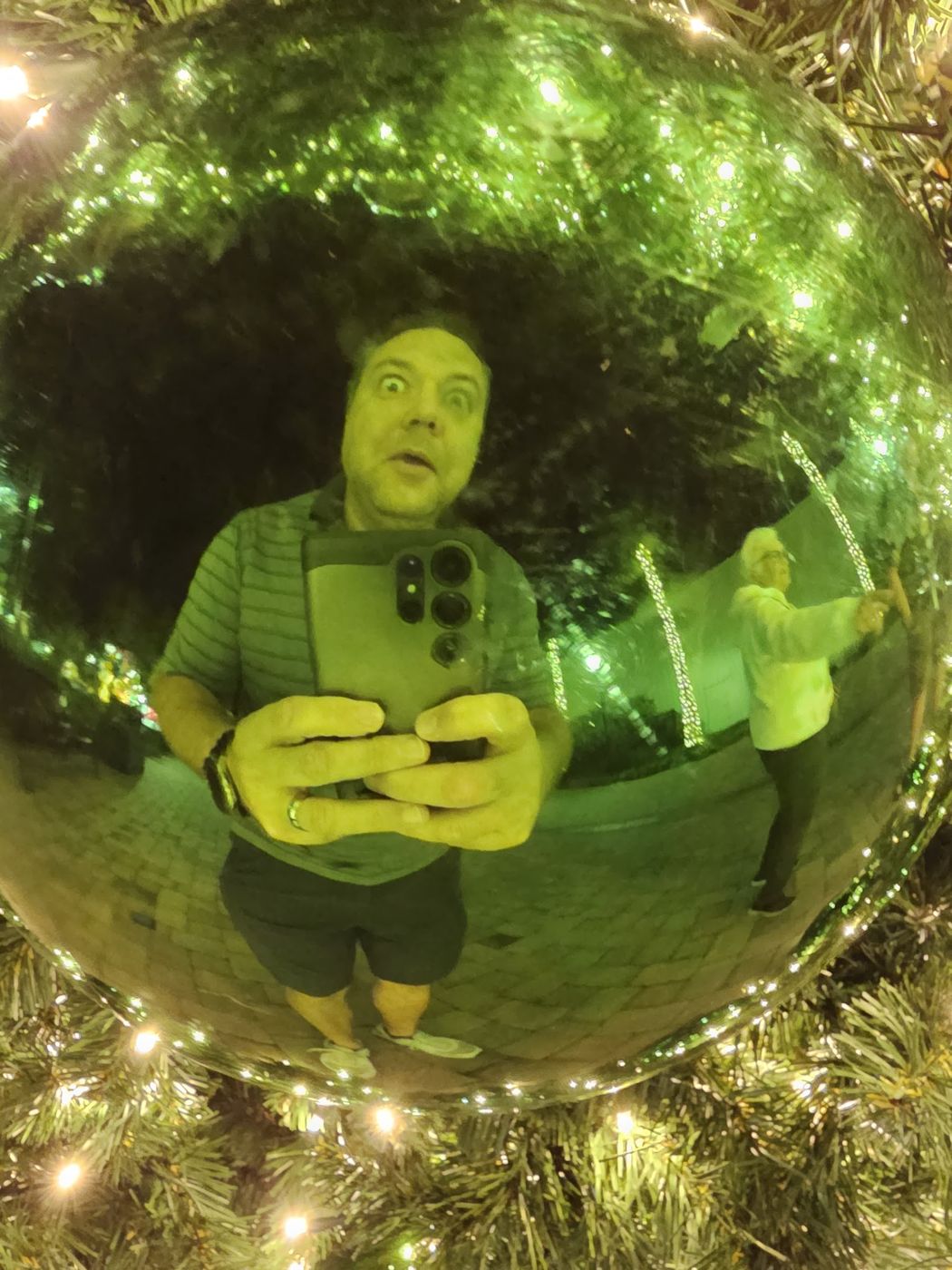 Justin reflected in a Christmas ornament
