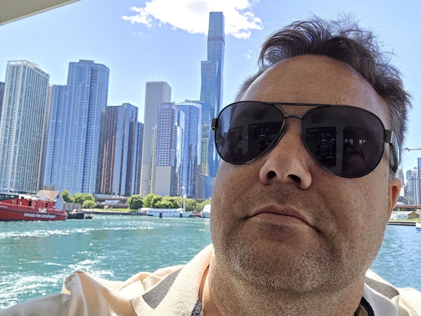 Justin on the water, Chicago behind him