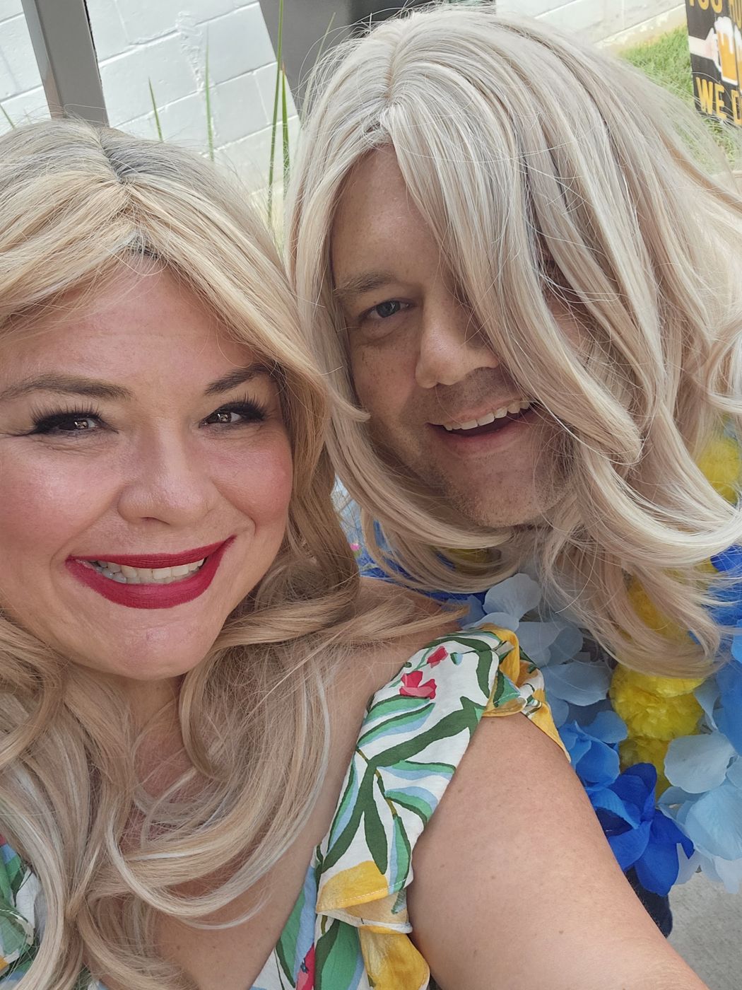 Justin and a friend in party wigs